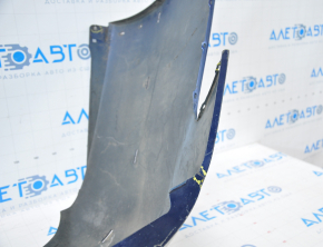 The rear bumper is bare, Toyota Camry v40 07-11 3.5 SE blue, dented, torn, with broken fasteners.