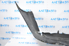 The rear bumper is bare, Toyota Camry v50 12-14 USA LE XLE black, dented, with tears and broken fasteners.