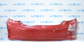 The rear bumper is bare, Toyota Camry v50 12-14 USA LE XLE red, dented, with tears and broken fasteners.