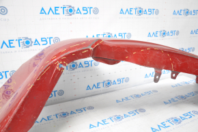 The rear bumper is bare, Toyota Camry v50 12-14 USA LE XLE red, dented, with tears and broken fasteners.