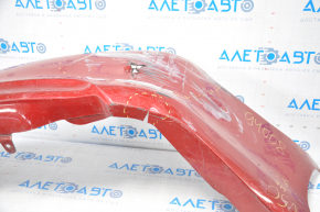 The rear bumper is bare, Toyota Camry v50 12-14 USA LE XLE red, dented, with tears and broken fasteners.