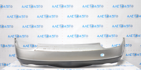 Subaru b9 Tribeca 2006-2007 silver rear bumper, torn fasteners, dented at the bottom, scratches