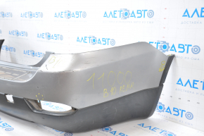 Subaru B10 Tribeca rear bumper, gray, with torn fasteners, dents, and scratches.
