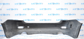 Subaru B10 Tribeca rear bumper, gray, with torn fasteners, dents, and scratches.
