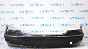 The rear bumper, bare, Mercedes W211 02-09, rest, black, is dented at the bottom, sawed off, the fastening is torn