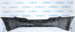 The rear bumper, bare, Mercedes W211 02-09, rest, black, is dented at the bottom, sawed off, the fastening is torn
