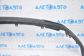The front bumper lip of Toyota Highlander 14-16 is dented, fractures, missing fragment, sawed, grille tears