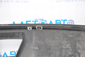 The lip of the rear bumper of the Chevrolet Volt 11-15 is dented on the left, torn, missing fragment, sawed, broken fasteners