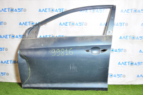 The front left door of a Hyundai Sonata 15-19, turquoise, has a dent in the front.