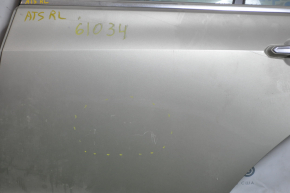 Rear left door assembly for a 1998 Cadillac ATS, silver, scratches