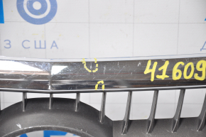 The grille of the Lexus RX400h 06-08 has a torn corner and swollen chrome.