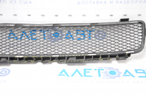 The lower grille of the front bumper of the Lexus GS300 GS350 GS430 GS450h 06-07 has tears in the fasteners and is dented.