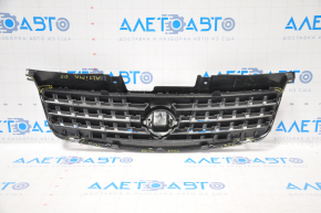 Nissan Alltima 2005 USA radiator grille has chrome breakage, tears, broken fasteners, torn guides, and a bump on the emblem.