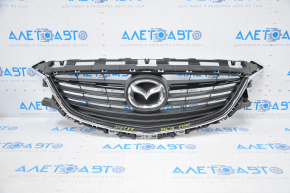 Radiator grill Mazda 6 13-17 complete with badge, broken fasteners, crack on molding, chrome bulged, bump on chrome