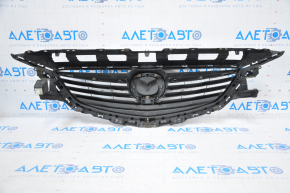 Radiator grill Mazda 6 13-17 complete with badge, broken fasteners, crack on molding, chrome bulged, bump on chrome