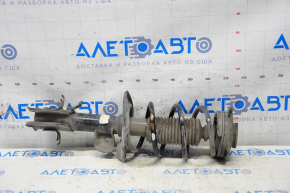 Shock absorber strut assembly front left Nissan Leaf 11-17 dented