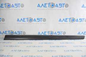 Lower front right door trim Nissan Rogue 14 is worn