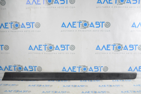 Lower front right door trim Nissan Rogue 14 is worn