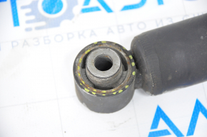 Rear shock absorber left Nissan Rogue 14-17 fwd large silent block, cracked silent blocks, dented, crooked