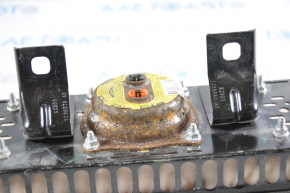 The passenger airbag in the dashboard of a 1998 Nissan Altima has a rusty squib.