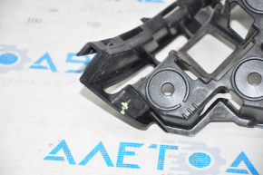 Rear bumper mount under the right light VW Jetta 15-18 USA broken guide