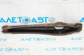 The lower rear right control arm of a Jeep Compass 11-16 is rusty and the silent blocks are torn.