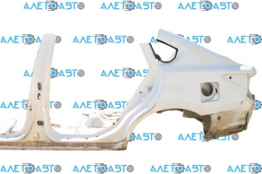 Rear left quarter wing of a 1913-15 Nissan Altima, pre-restored white, dents, with a central pillar