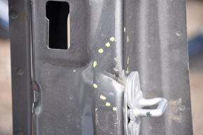 The central right body pillar of Dodge Journey 11-14 is sawn off, dented at the hinge