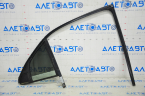 Rear left triangle door glass for a Cadillac CTS 14-19, complete with glass seal