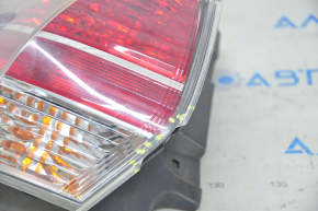Light outer wing left Nissan Rogue 14-16 chip on glass, crack on body