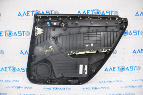 Door trim card rear left VW Passat b7 12-15 USA black, dented on top, cracks in the fastener