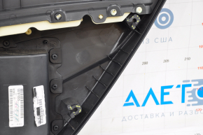 Door trim card rear left VW Passat b7 12-15 USA black, dented on top, cracks in the fastener