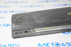 Lower rear right door trim for a 1996 Lincoln MKX with chrome, cracked chrome, broken mounting