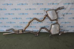 The rear muffler with barrels of the BMW 335i e92 07-11 is dented