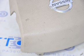 Driver's steering wheel airbag for a 2007-2009 Nissan Versa, beige, scratches