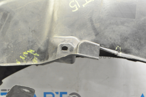 The rear left fender liner of a Subaru Outback 15-16 is torn.