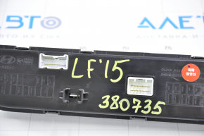Hyundai Sonata 15-17 clock panel with radio control, crack in overlay, chrome chipped