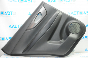 Door trim card rear left Nissan Rogue 14-16 black with black insert plastic, molding graphite gloss, armrest leather, scratches, bump