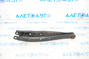 The lower rear left control arm of a Subaru Forester 14-18 SJ has a torn silent block.