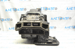 The bare heater housing of a 1920 Nissan Rogue is black.