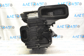 The bare heater housing of a 1920 Nissan Rogue is black.