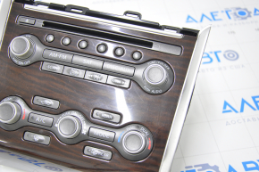 Climate control and audio control Nissan Pathfinder 13-16 under navigation, wood scratches on the trim