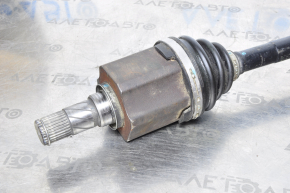 The front left half-shaft of a Nissan Murano z51 09-14 has a torn inner CV joint boot.