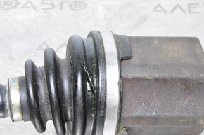 The front left half-shaft of a Nissan Murano z51 09-14 has a torn inner CV joint boot.