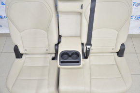 Rear row of seats 2nd row Infiniti QX50 19-20 beige leather tear in the leather of the right headrest