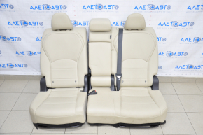 Rear row of seats 2nd row Infiniti QX50 19-20 beige leather tear in the leather of the right headrest