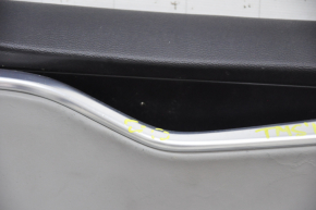 Door trim card front left Tesla Model S 12-15 pre-rest black, with gray insert, with backlight, swollen leather, bumps on chrome