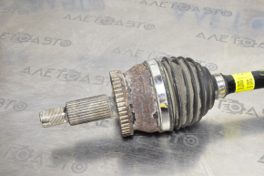The front left half-shaft of a Kia Optima 16-20 has a torn inner boot.