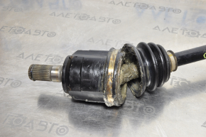 The front left half-shaft of a Kia Optima 16-20 has a torn inner boot.