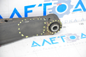 The lower rear left transverse control arm of the Subaru Forester 19-24 SK is dented, with microcracks.